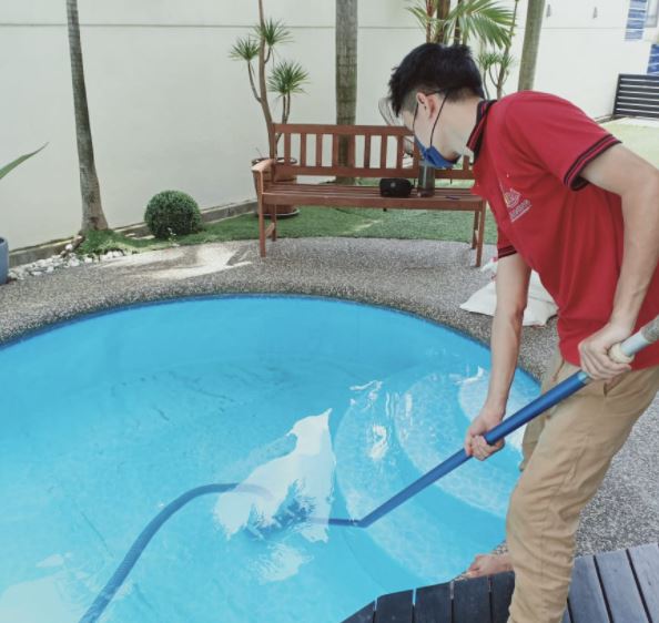 Ultra Pool Care swimming pool contractor at work in KL